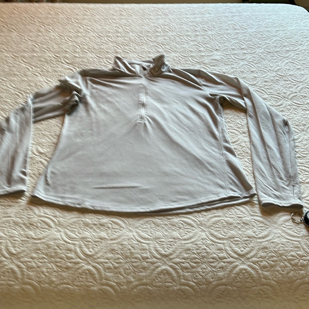 Pale gray Under Armour long sleeved work out top.